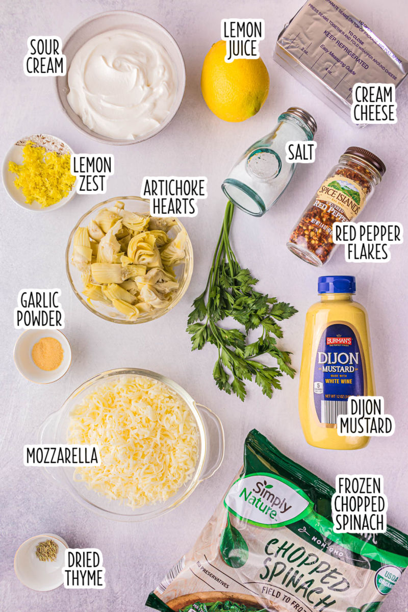 ingredients to make spinach artichoke dip with text labels