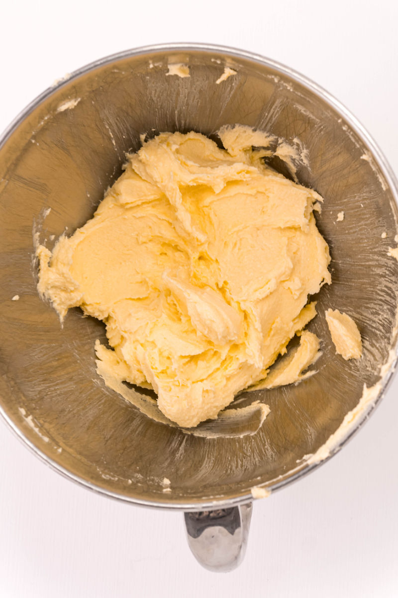 butter and sugar mixed together in a stand mixer bowl