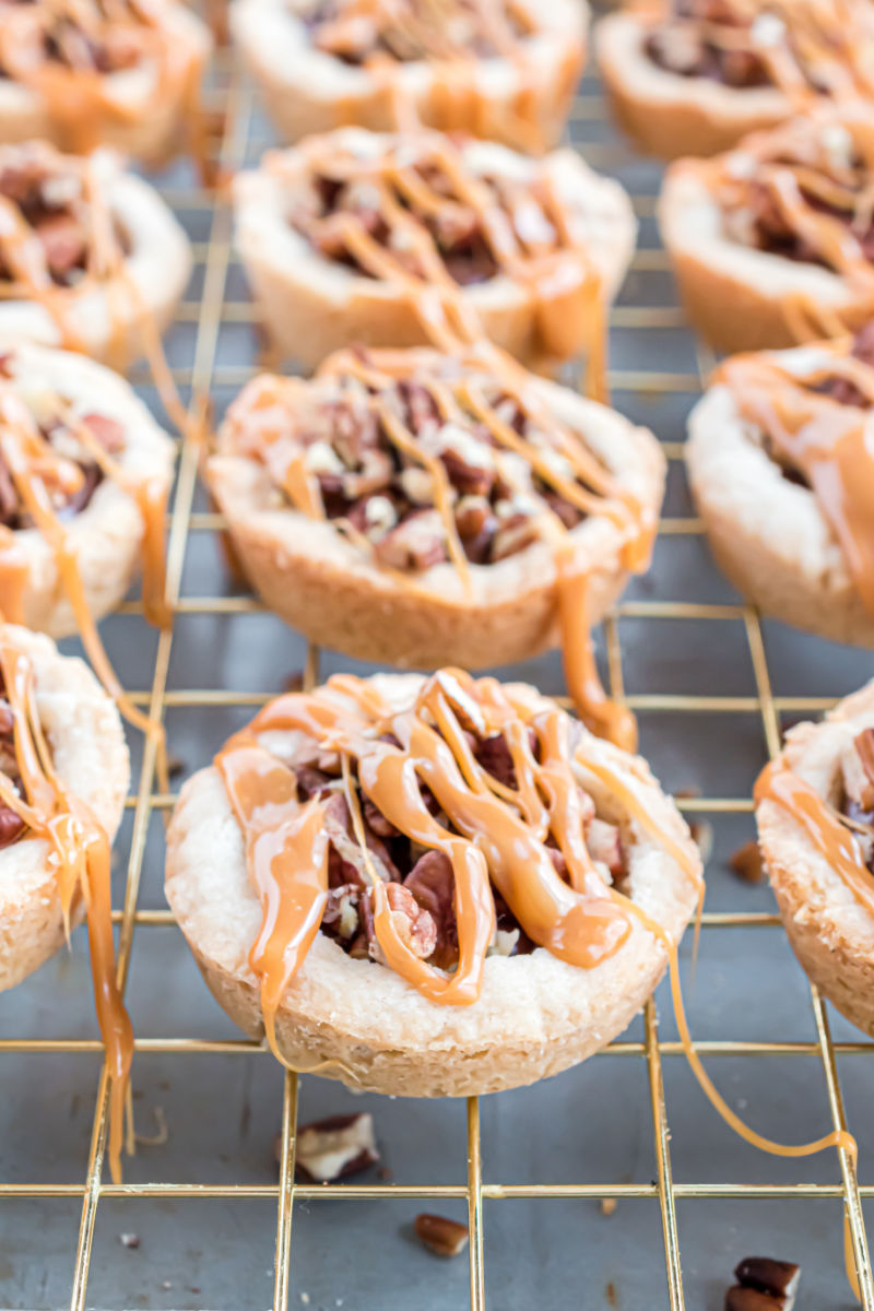 turtle cookie cups topped with caramel drizzle