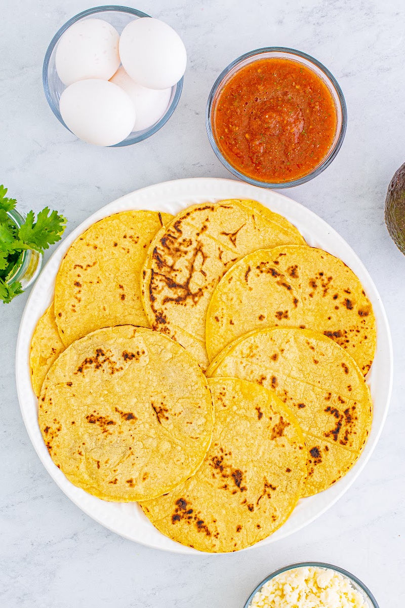 lightly charred corn tortillas on a plate