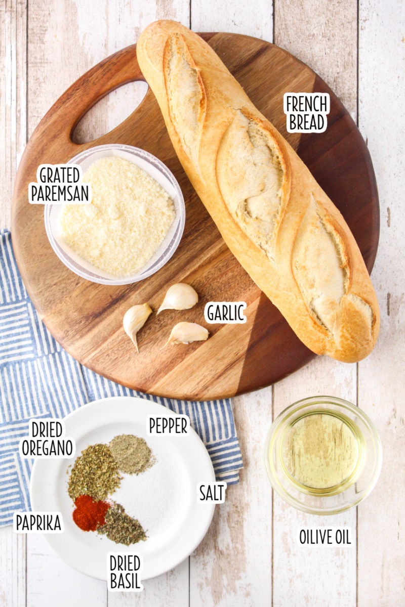 ingredients to make homemade garlic parmesan croutons with text labels
