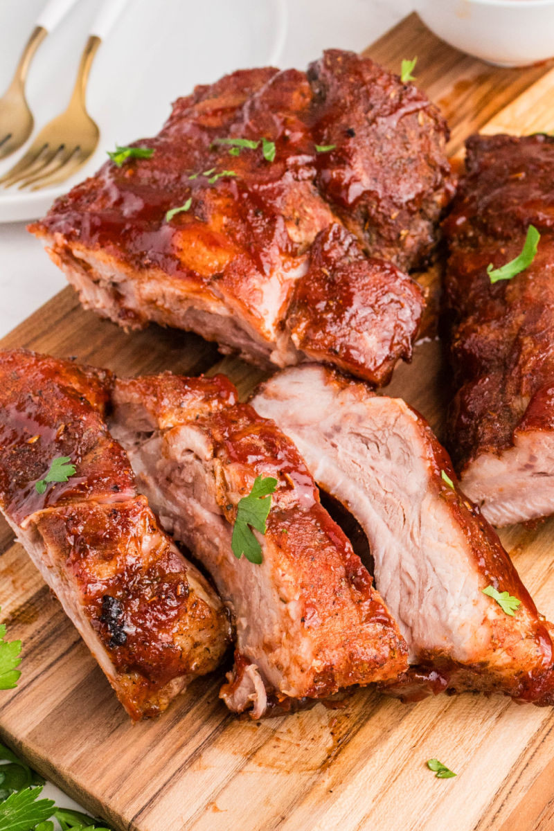 close up of dry rub ribs cut into individual ribs on a cutting board
