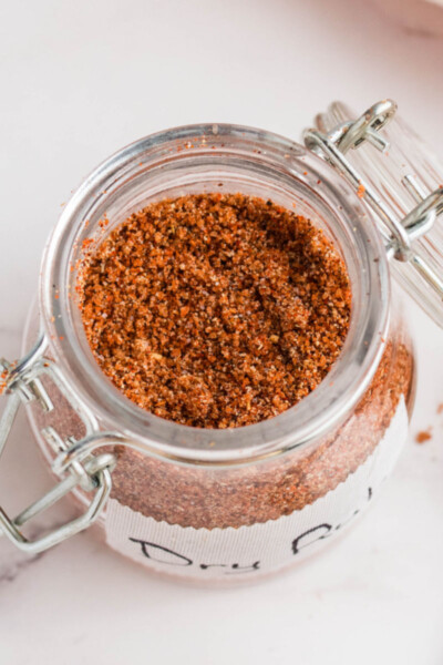 looking down into a jar of dry rub for ribs