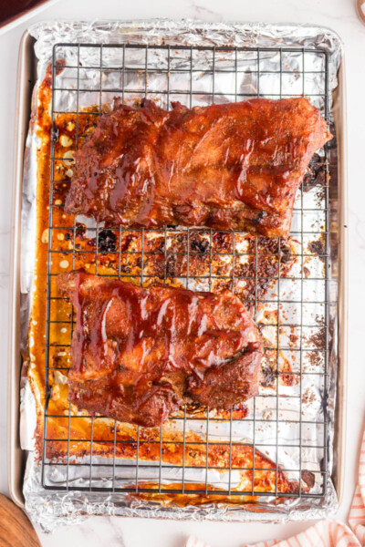 broiled dry rub ribs with bbq sauce on the wire rack