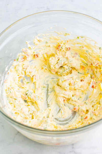 beaten cold crab dip base in a glass mixing bowl