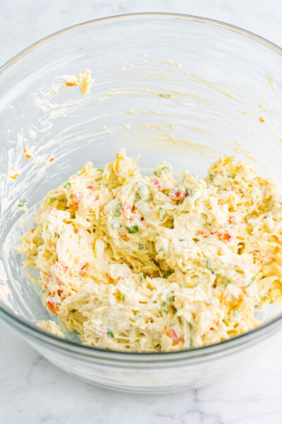 cold crab dip mixture in a glass bowl before chilling