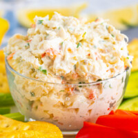 square image of cold crab dip in a glass bowl