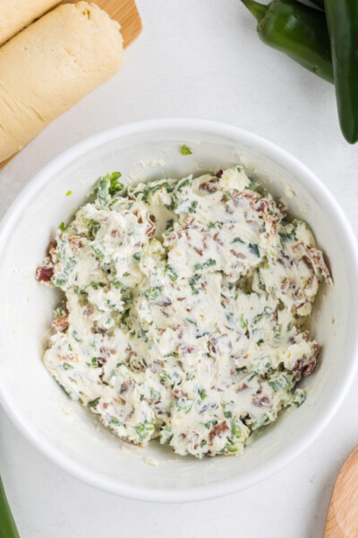 jalapeno popper bite filling mixed together in a bowl
