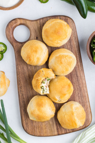baked jalapeno popper bites on a wooden serving board