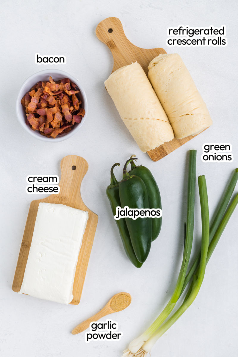 ingredients to make jalapeno popper bites laid out on a counter with text labels