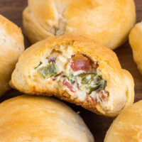 square close up image of a jalapeno popper bite with a bite taken out