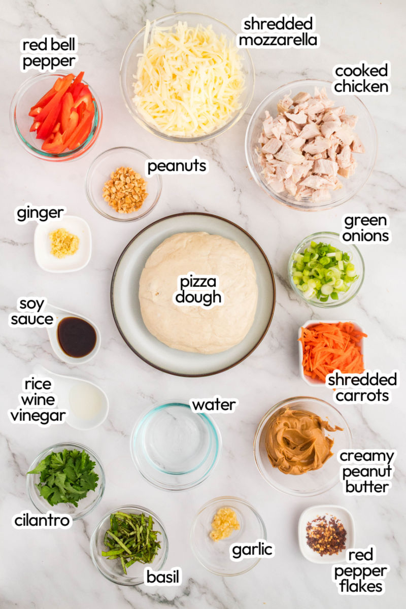 thai chicken pizza ingredients with text labels on a counter