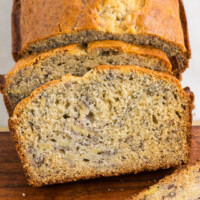 square image of banana bread slices on a cutting board