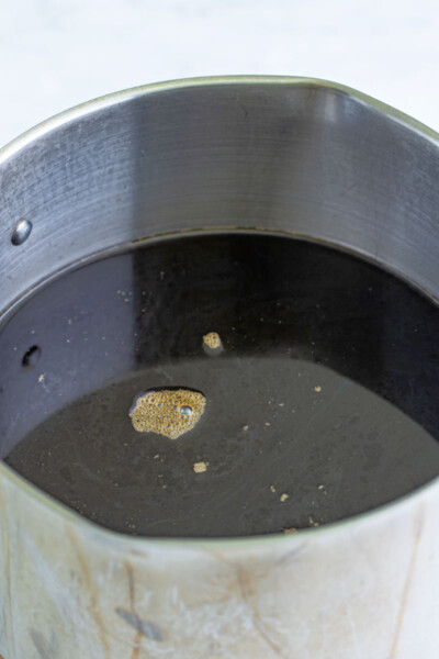 coffee and simple syrup mixed together in a large pot