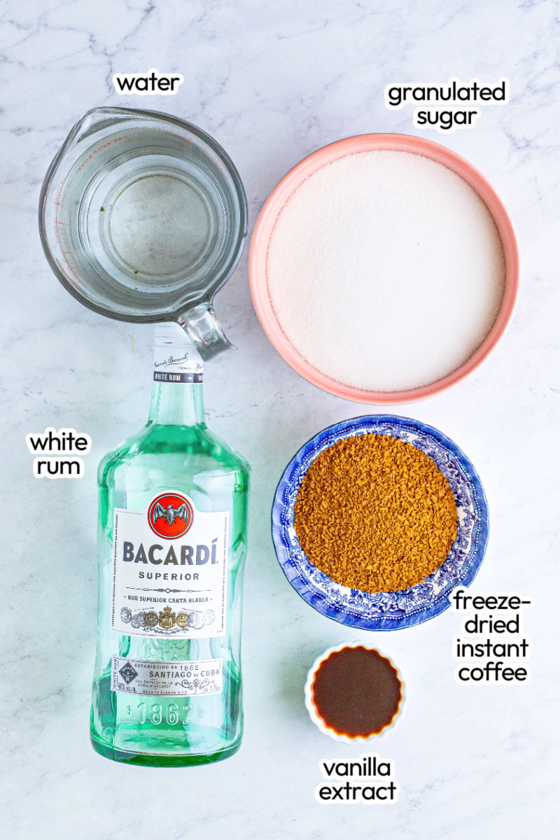 ingredients to make homemade kahlua on a counter with text labels